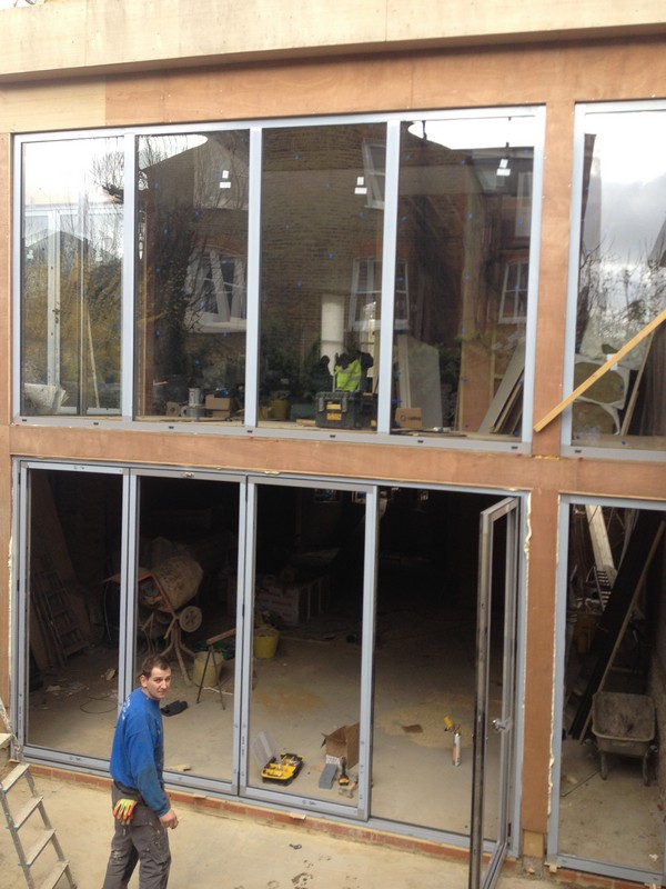 Aluminium bi-fold doors with two-storey glazing in Tufnell Park