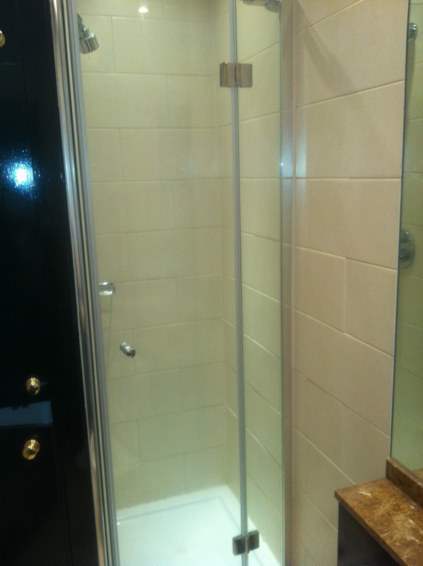 Frameless glass shower enclosure with chrome fittings in Tufnell Park