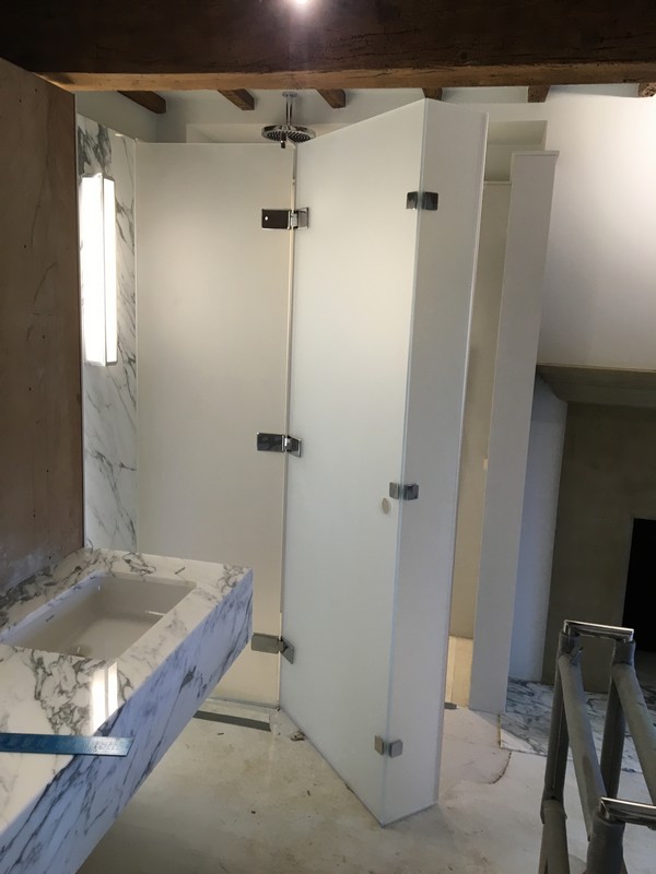 Bespoke frosted glass shower enclosure in Tufnell Park luxury bathroom